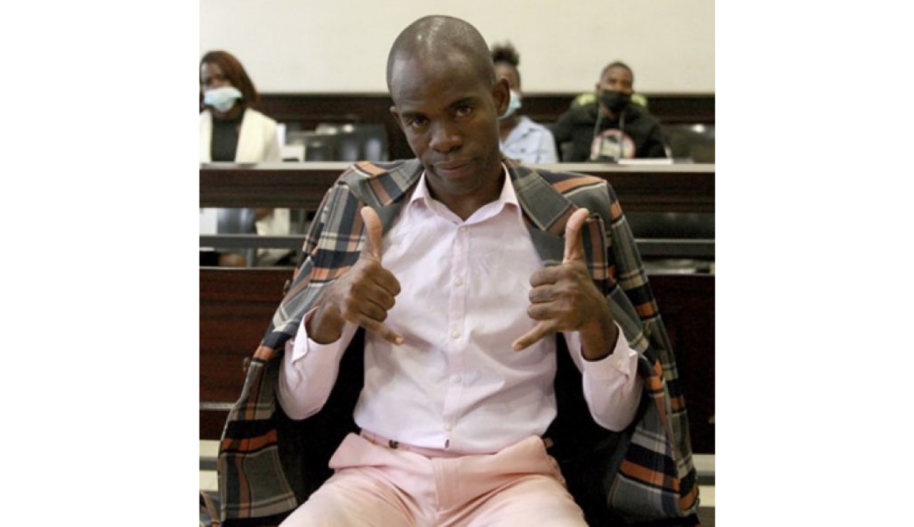 Tanaice Neutro seated in court with his two thumps up