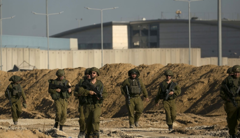 Israeli soldiers secure an area near the Erez Crossing, near the border with Israel in the Gaza side of the border on December 15, 2023, northern Gaza Strip. As the IDF have pressed into Gaza as part of their campaign to defeat Hamas, they have highlighted the militant group's extensive tunnel network as emblematic of the way the group embeds itself and its military activity in civilian areas. Photo by Amir Levy/Getty Images