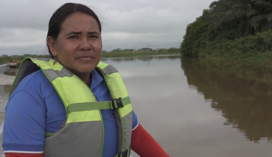 Yuly Velasquez travels in a boat on the river
