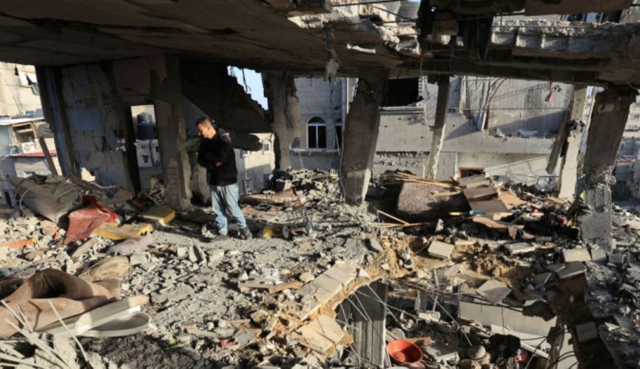 Men check the damages to the house of the Palestinian Nofal family, who were killed during Israeli bombardment, on January 10, 2024 in Rafah in the southern Gaza Strip ©AFP via Getty Images.