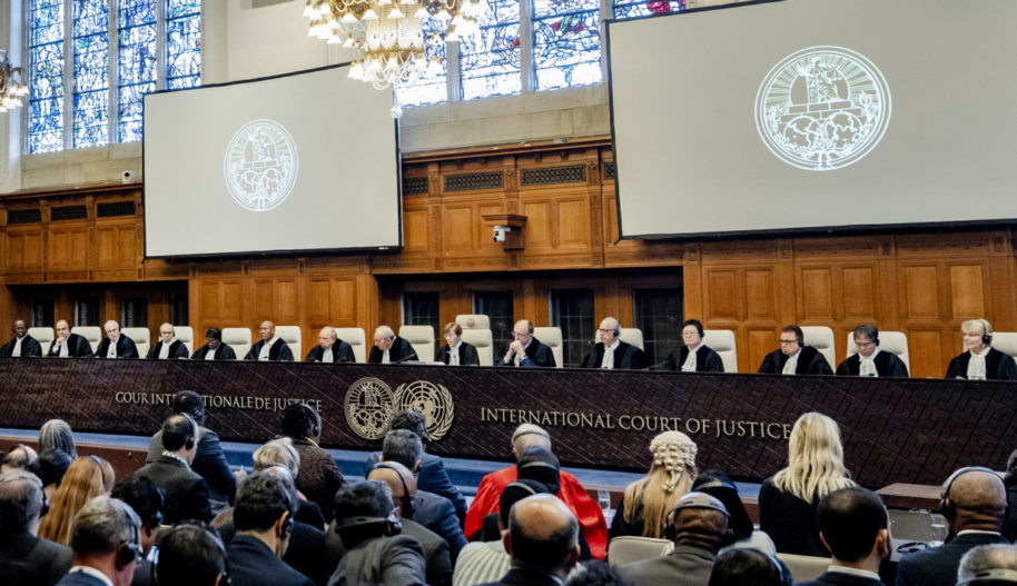 "ICJ President Joan Donoghue (C) speaks at the International Court of Justice (ICJ) prior to the verdict announcement in the genocide case against Israel, brought by South Africa, in The Hague on January 26, 2024. The UN top court on January 26, 2024 ordered Israel to allow humanitarian access in Gaza, handing down a landmark decision in a case that has drawn global attention. Israel must take "immediate and effective measures to enable the provision of urgently needed basic services and humanitarian assistance to address the adverse conditions of life faced by Palestinians," ruled the court in its highly anticipated verdict."