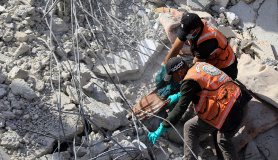 Civil defense teams and locals carry out search and rescue efforts after an Israeli attack hits Zorob family building in Rafah, Gaza on April 01, 2024. Photo by Yasser Qudaih/Anadolu via Getty Images.